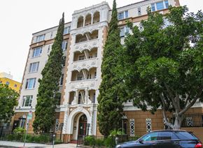 Los Angeles apartment for rent - A tall building with a tree in front of it.