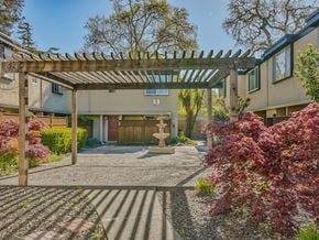 Santa Rosa apartment for rent - a pergola with a fountain in front of a building