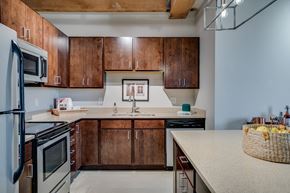 St Paul apartment for rent - Lofts kitchen with industrial style lighting and exposed beams