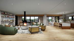 Minneapolis apartment for rent - A modern living room with a fireplace and a green sofa.