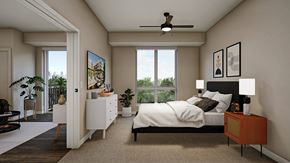 Minneapolis apartment for rent - A bedroom with a large bed, a ceiling fan, and a painting on the wall.