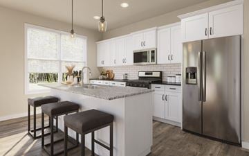 Woodbury apartment for rent - A kitchen with white cabinets and a granite countertop.