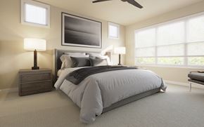 Woodbury apartment for rent - A bedroom with a large bed, a ceiling fan, and a painting on the wall.