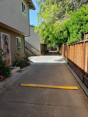 San Jose apartment for rent - a driveway in front of a house with a wooden fence