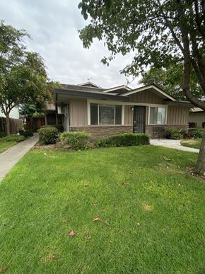 San Jose condo for rent - a house with a yard and sidewalk in front of it