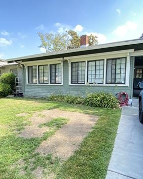 Santa Clara apartment for rent - a blue house with a lawn and a sidewalk