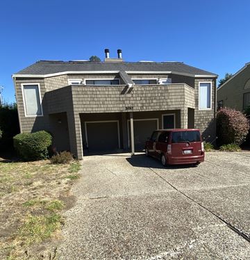 Aptos townhouse for rent - A house with a red car parked in front.