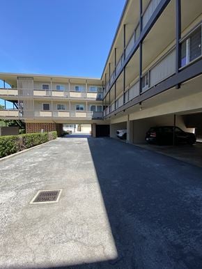 San Mateo apartment for rent - an empty parking lot in front of an apartment building