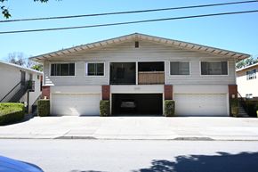 San Jose apartment for rent - a white house with two garage doors
