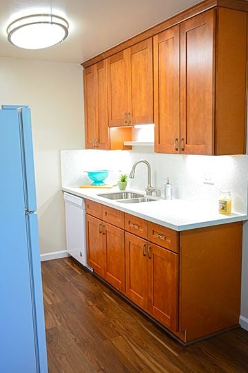 Santa Clara apartment for rent - a kitchen with wooden cabinets and a sink and a refrigerator