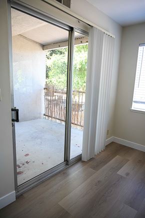 San Jose apartment for rent - a living room with a sliding glass door to a balcony