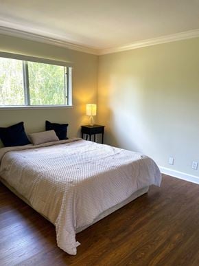 Sunnyvale apartment for rent - Bedroom with bed and a window Exterior of the building with lots of Greenery Prodesse Property Group 418 Brahms Way Sunnyvale CA 94087
