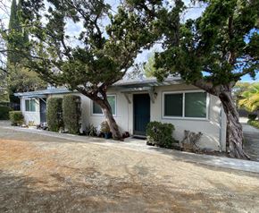 Cupertino apartment for rent - a small white house with a tree in front of it