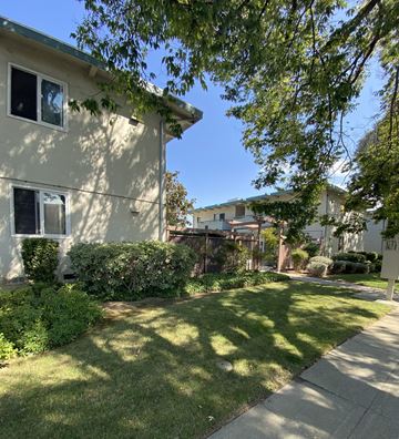 San Jose apartment for rent - the yard of a house with a sidewalk and trees