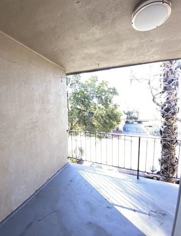 San Jose apartment for rent - a view of the balcony from the living room of a house with a balcony railing