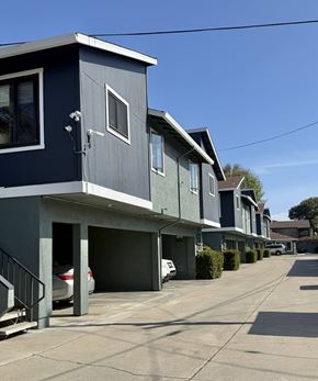Monterey apartment for rent - A row of houses with garages and driveways.