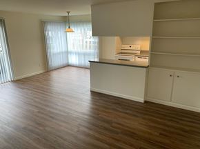 San Mateo apartment for rent - an empty kitchen and living room with wood flooring