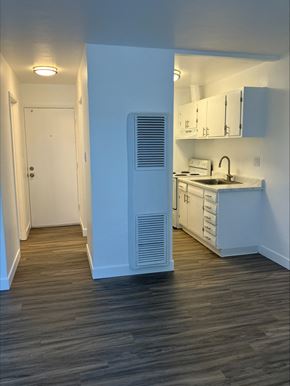 East Palo Alto apartment for rent - an empty kitchen with white cabinets and a white refrigerator