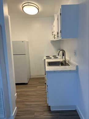 East Palo Alto apartment for rent - an empty kitchen with a sink and a refrigerator