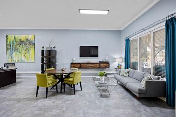 Austin apartment for rent - A modern living room with a yellow dining table and grey sofa.