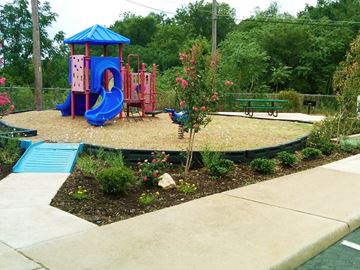 Austin apartment for rent - a childrens play area with a playground and a slide