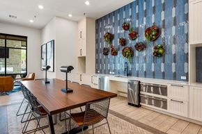Austin apartment for rent - A kitchen with a wooden table and chairs. at The Haywood Apartments, Texas, 78748