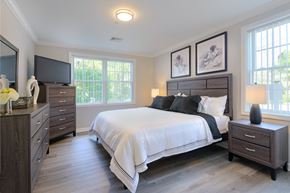 Wakefield apartment for rent - a bedroom with a bed and two dressers