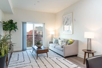 Quincy apartment for rent - a living room with a couch and a sliding glass door