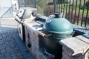 Arden apartment for rent - A green grill is on a stone platform.