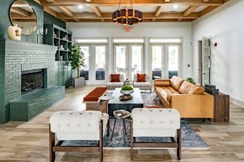 A living room with a green fireplace