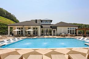 Cartersville apartment for rent - A large house with a pool in front at Arcadia Cartersville Apartments, Cartersville, Georgia