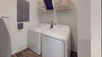 A washer and dryer in a laundry room