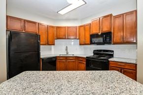 Jacksonville apartment for rent - Granite Counter Tops In Kitchen at Reserve Bartram Springs, Jacksonville, 32258