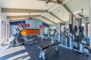 Little Rock apartment for rent - A gym with a variety of equipment including treadmills, weights, and a bench. at Brightwaters Apartments, Little Rock, Arkansas