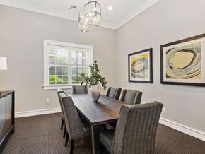 Overland Park apartment for rent - Conference Space with Elegant Lighting and Wood Plank Vinyl Flooring at Cambridge Square Apartments, Overland Park, KS 66211
