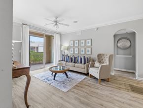 Hardeeville apartment for rent - A living room with a sofa, armchair, and a coffee table.