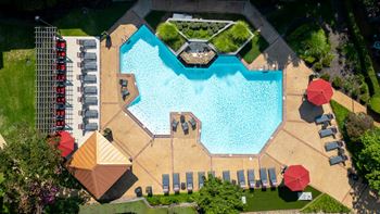 Inviting swimming pool with fountain and sundeck
