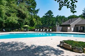 Roswell apartment for rent - Swimming pool with a house and trees in the background at 1900 Rosemont, Roswell