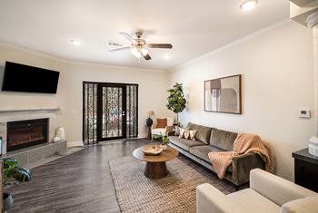 A living room with a couch and a fireplace