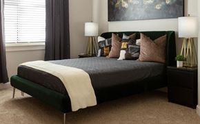 North Little Rock apartment for rent - a bedroom with a bed and pillows at Esplanade District Apartments, Little Rock, AR