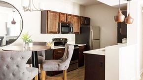 North Little Rock apartment for rent - a kitchen and dining room with a table and chairs at Esplanade District Apartments, Arkansas