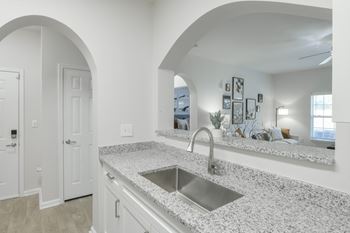 A kitchen with a sink and a countertop.
