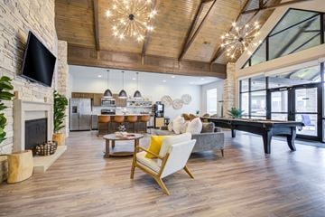 Little Rock apartment for rent - A living room with a fireplace and a television on the wall.