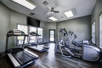 Large state-of-the-art fitness center with fit studio featuring wellbeats system and trx