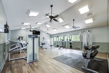 Large state-of-the-art fitness center with fit studio featuring wellbeats system and trx