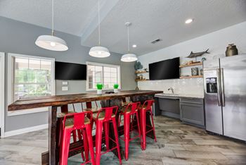 Game room with arcade games, sand shuffle board, and foosball