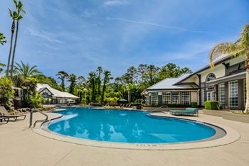 Super pool with waterfall cascading over rock grotto plus wading pool