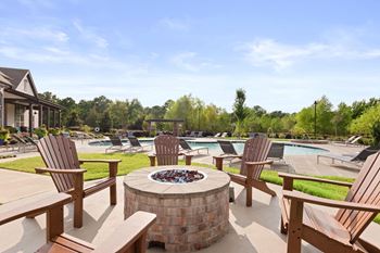 Outdoor patio with chairs and firepit