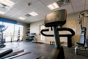 A fitness room with treadmills and other exercise equipment