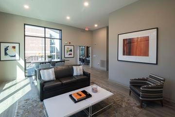 Memphis apartment for rent - A living room with a couch, chair, and a painting on the wall.